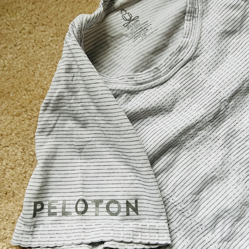 Phat Buddha x Peloton branded seamless white short sleeve shirt
